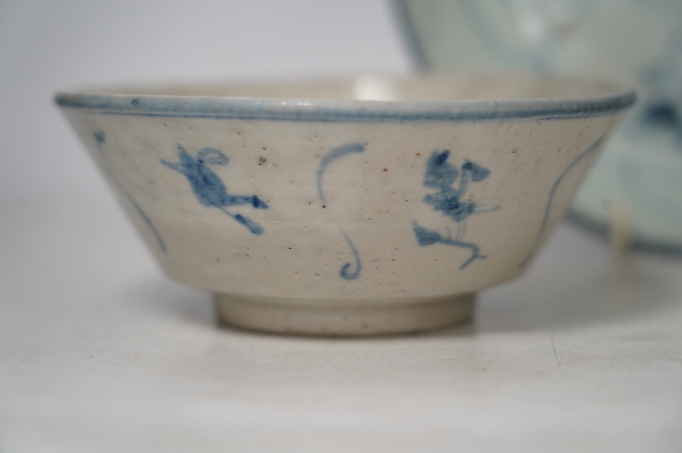 Three pieces of Chinese Teksing cargo comprising two bowls and a dish, largest 18.5cm. Condition - fair, hairline crack to dish